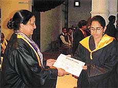 A student of the Government College for Women receives her degree at the annual convocation  of the college in Ludhiana on Monday.