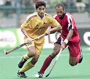 Cuba's Yuri Perez tries to stop Malaysia's Keevan Raj