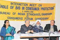 BIS Deputy Director-General V.K. Kapoor (second from left) speaks at an interaction meet in Chandigarh on Tuesday. Others in photo are (from right to left) Mr R.D. Angra, Mr Jaidev Singh and Mrs Renuka Salwan.