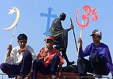 Indian Christian boys hold symbols