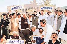 Opposition MLAs sit in dharna outside the Haryana Vidhan Sabha