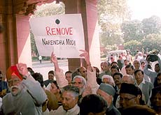Parliamentarians of Opposition parties demonstrate at the main entrance of Parliament House