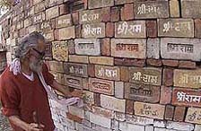 Bricks with 'Shri Ram' inscribed on them being inspected by caretaker Chaitanya Maharaj