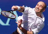 Andre Agassi serves to Xavier Malisse of Belgium during the first set of their semifinal match in the Franklin Templeton Tennis Classic in Scottsdale, Arizona, on Saturday.