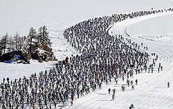 An aerial view of cross-country skiers racing over the frozen lake Sils during the annual Engadin ski marathon, near Sils, on Sunday. 
