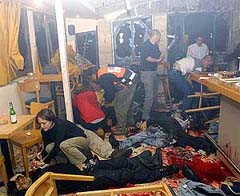 Patrons and paramedics attend to wounded inside Moment cafe 