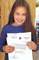 Five-Year-Old Israeli girl Kim Teldan holds a letter she received from Palestinian President Yasser Arafat 
