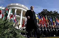 President George W. Bush walks toward the stage to begin a ceremony