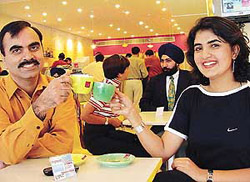 Cheers: Irina Brar, top lady golfer of the country, at the inauguration of Cafe Coffee Day in Sector 35, Chandigarh, on Wednesday.