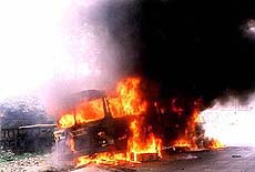 Angry mob sets fire to a bus