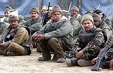Border Security Force troopers rest in their camp following a gunbattle at Pulwama