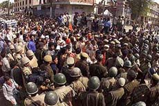 The police tries to stop the procession