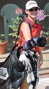 A woman caddy during the Royal Challenge Indian Open 2002 at the Delhi Golf Club.