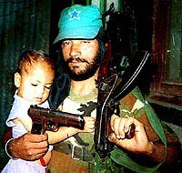 Growing under the shadow of gun.