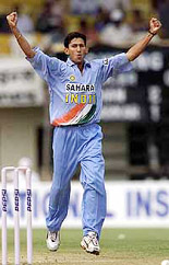 Ajit Agarkar celebrates after claiming the wicket of Travis Friend 