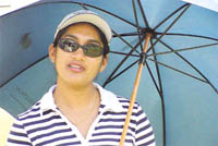 A spectator during the final day of the Royal Challenge Open Golf Tournament 2002 at Delhi Golf Club.