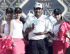 India's Vijay Kumar holds aloft the Indian Open trophy 