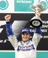 BMW Williams driver Ralf Schumacher of Germany celebrates his victory 