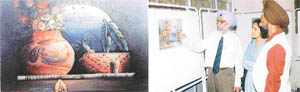 A painting of Harparkash Jingal on display at an exhibition in Students Home, PAU; and (right) the artist explains some finer points of his works to visitors.
