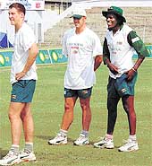 Zimbabwes bowlers Heath Streak (C) and Pommy Mbangwa (R) during their net practice on the eve of the last and final one-day international match against India at Nehru Stadium in Guwahati on Monday.