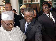 Presidents Olusegun Obasango of Nigeria, Thabo Mbeki of South Africa and Robert Mugabe of Zimbabwe ( from left ) after speaking to the press following their meeting at State House in Harare on Monday.