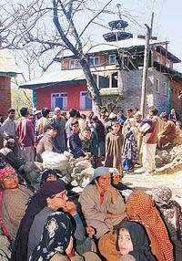 Villagers gather near a mosque