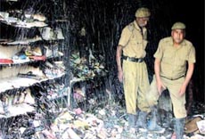Firemen in a shop, which was gutted in Sarojini Nagar in the Capital on Thursday.
