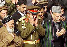 Afghan interim leader Hamid Karzai, right, Deputy Defence Minister Gen. Abdul Rashid Dostum, centre, and former Afghan President Burhanuddin Rabbani