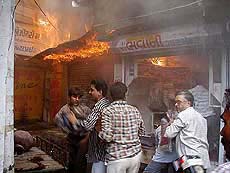 Rioters loot goods from a store