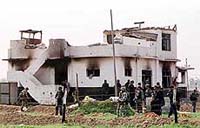 Nepalese army and policemen inspect the remains