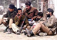 Jawans of the Special Operations Group relax after a night-long operation