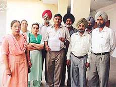 Members of the Punjab Government College Coaches Association on their way to present a memorandum to Mr Khushal Behl