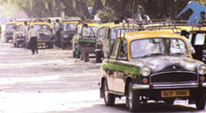 A line of taxies hired to carry the ballot boxes.