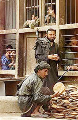 Prisoners wait to get bread