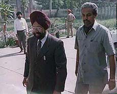 Punjabi University Vice-Chancellor Dr J. S. Ahluwalia arrives at the office of the IGP