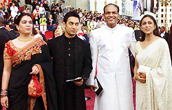 Indian actor Aamir Khan and director Ashutosh Gowarikar arrive with unidentified guests