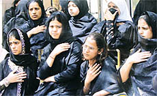 Shiite Muslim women taking part in a Moharram procession in the Capital on Monday.