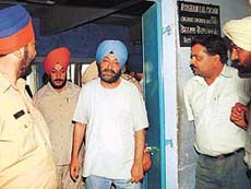 PPSC Chairman Ravinder Pal Singh Sidhu is produced at a court