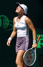 Martina Hingis of Switzerland smiles after winning a game