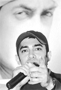 Aamir Khan talks to mediapersons in front of the poster of Lagaan