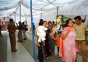 Policemen evacuate panic-stricken pilgrims