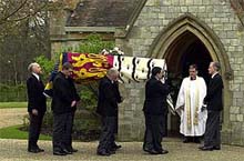 Pallbearers pause with the coffin of Britain's late Queen Mother