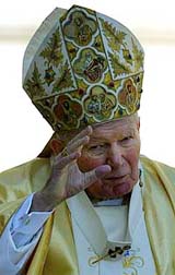 Pope John Paul II waves to a packed sunny Saint Peter's Square