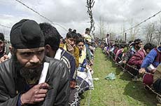 Kashmiri youth wait in long queues outside the army camp during a recruitment programme in Anantnag, 65 km south of Srinagar, on Tuesday. 