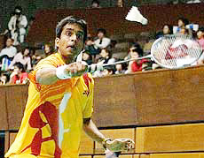 Pulella Gopichand returns against Lai Kuan Hung of Taiwan during the mens singles first round match at the Yonex Japan Open Badminton Championships in Tokyo on Wednesday.