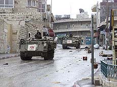 Israeli soldiers drive through the streets of the West Bank city of Bethlehem
