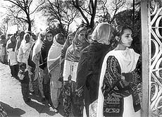 Voting for democracy: Women queuing up to exercise their franchise.