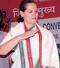 Congress President Sonia Gandhi takes the salute