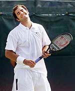 Pete Sampras of the USA reacts after losing a point to Alex Corretja of Spain