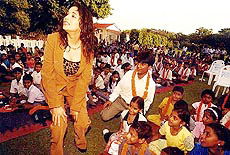 Madhuri Dixit with children at Basant Utsav at the Raj Bhavan in Kolkata on Saturday. 
